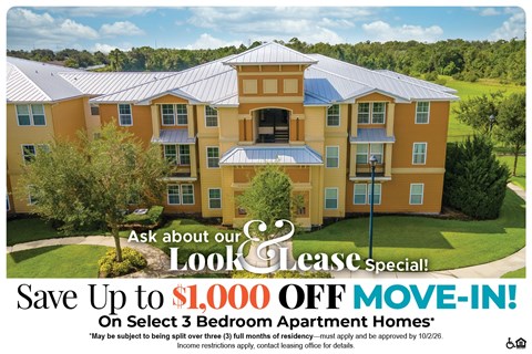 A large apartment complex advertises a special lease offer.
