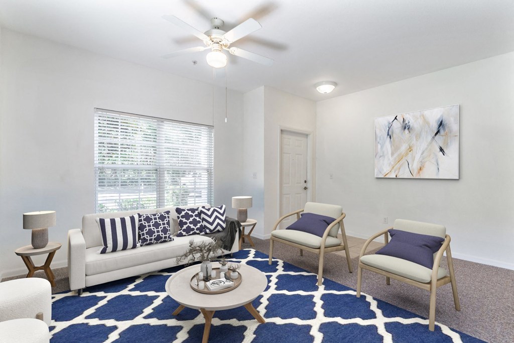 a living room with a couch and two chairs