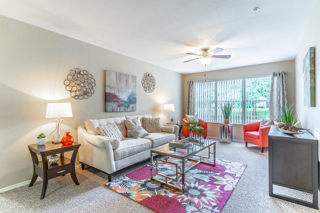 our apartments offer a living room with a couch coffee table and tv