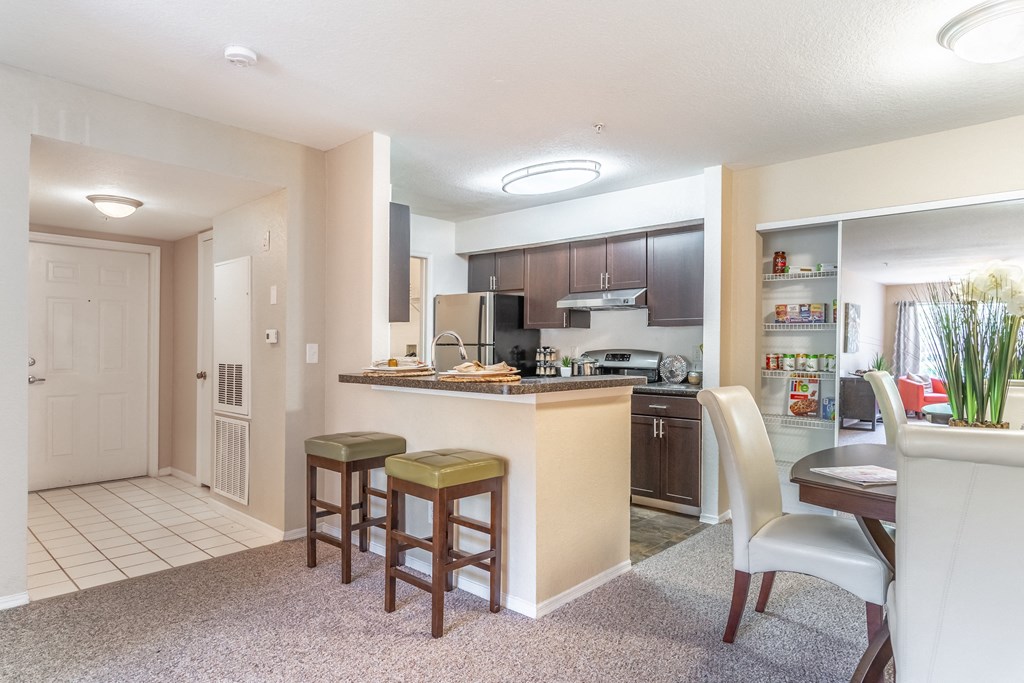 a kitchen and dining area in a 555 waverly unit