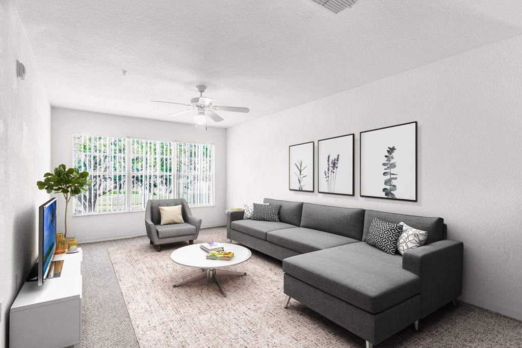 a living room with a couch chair and coffee table