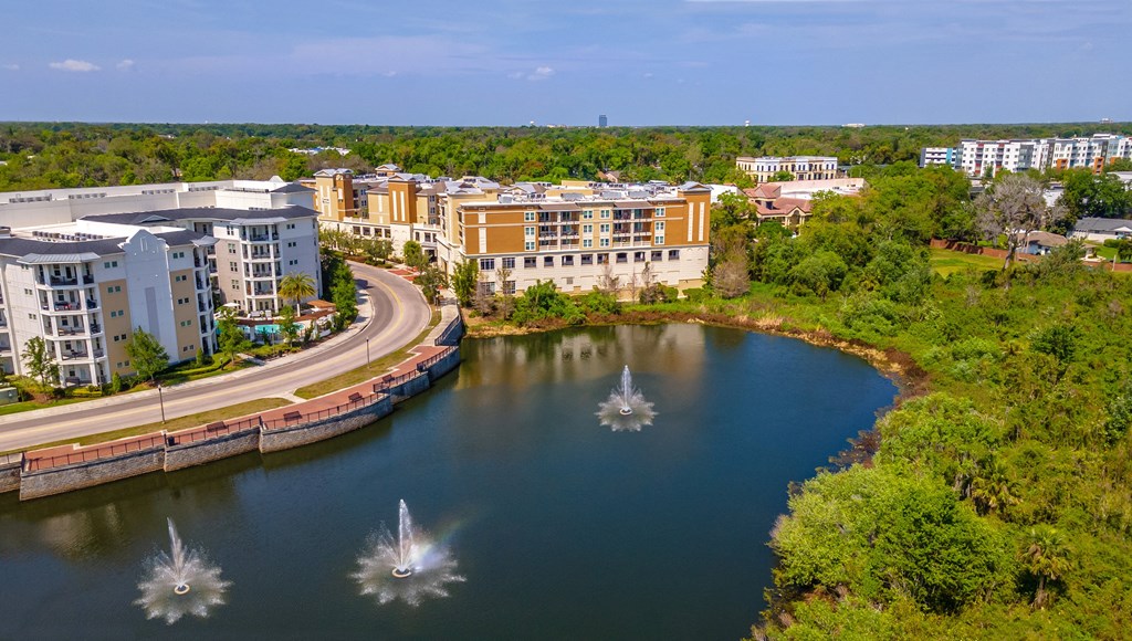 a view of a lake with buildings in the background