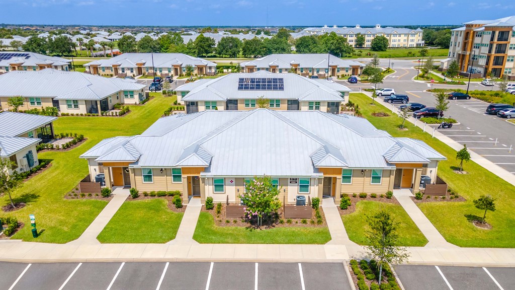 an aerial view of a building with a large metal roof