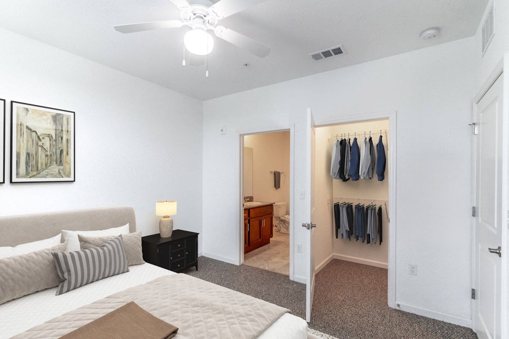 a bedroom with a large bed and a closet