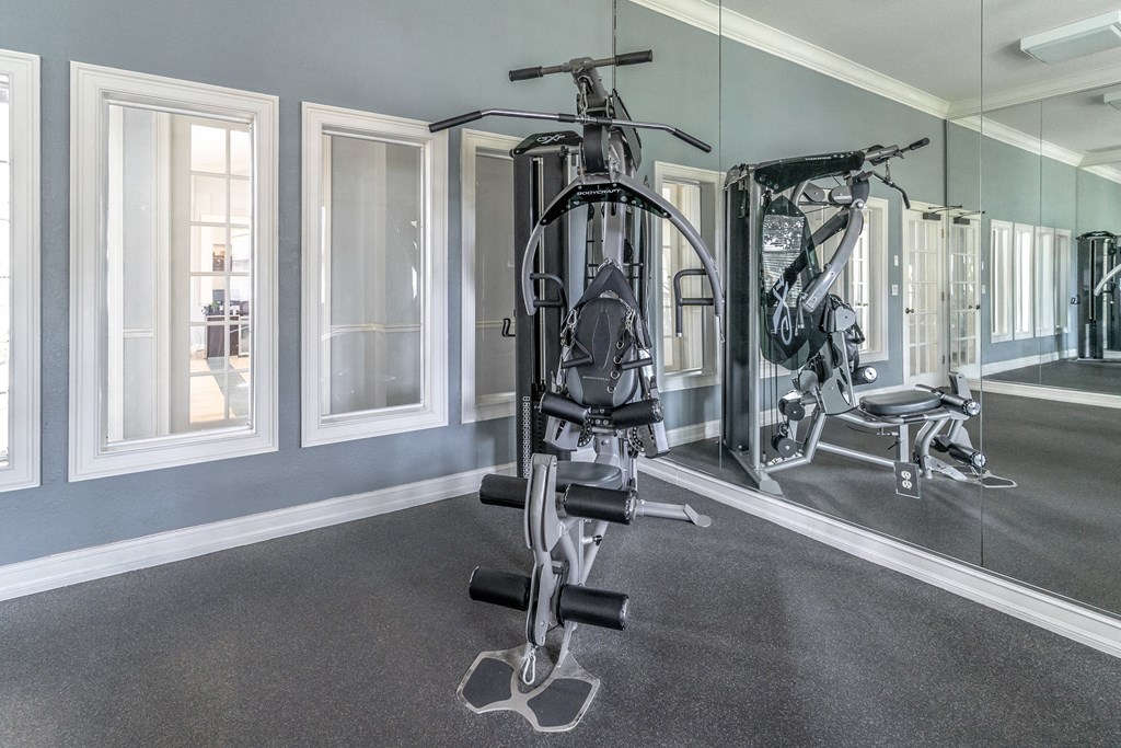 the gym at the enclave at woodbridge apartments in sugar land, tx