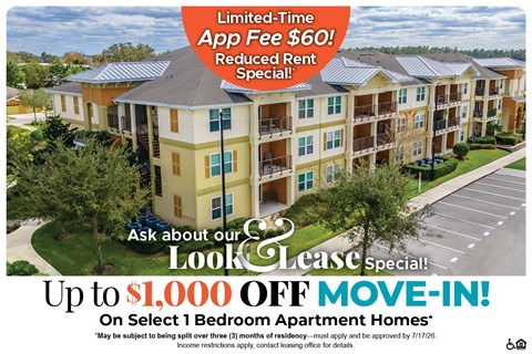 A large apartment complex advertises a limited-time app fee reduction and a special move-in offer.