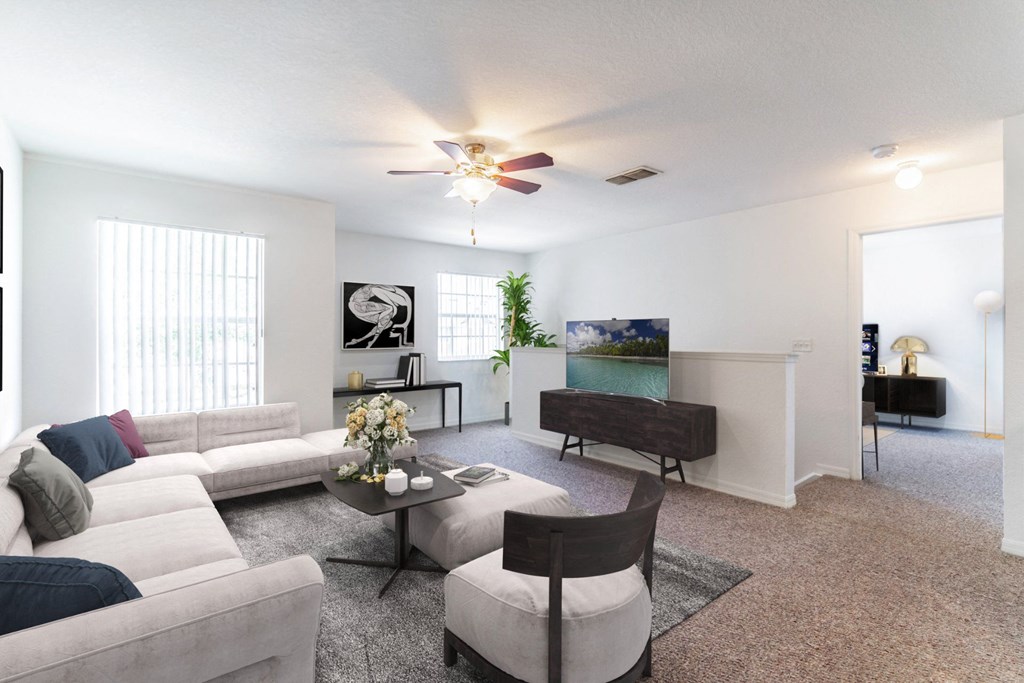 a living room with white couches and a coffee table
