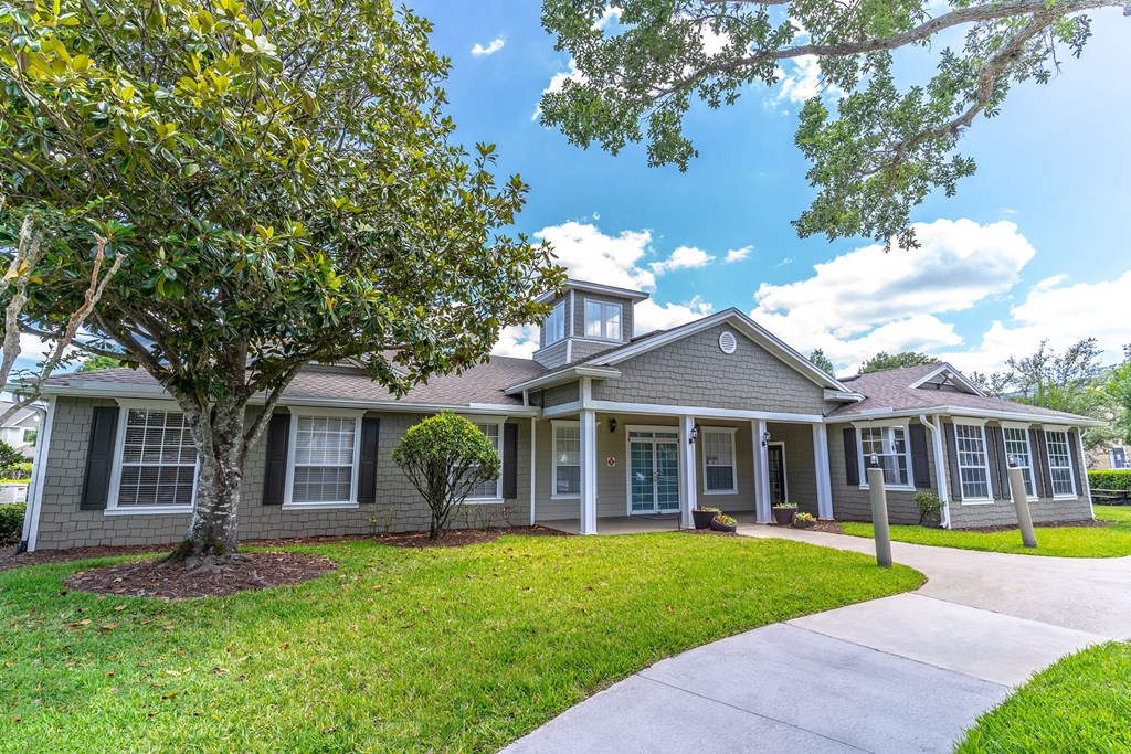 clubhouse with a tree in front of it