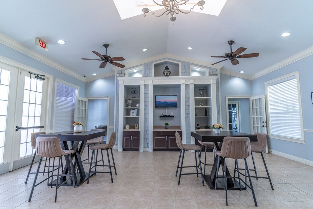 clubhouse area with tables and tv