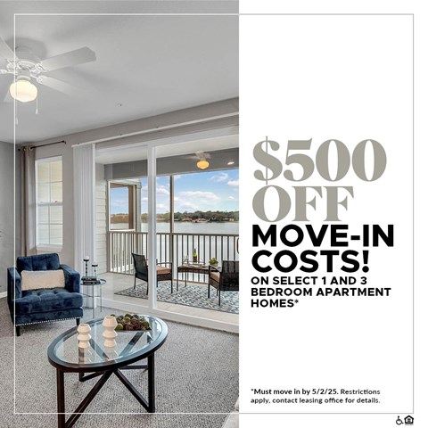 A living room with a blue chair and a glass table with a sign offering $500 off move-in costs.