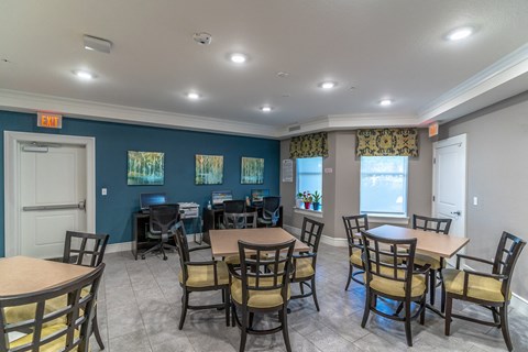 a seating area with tables and chairs