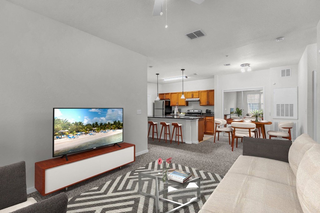 a living room with a couch a coffee table and a tv