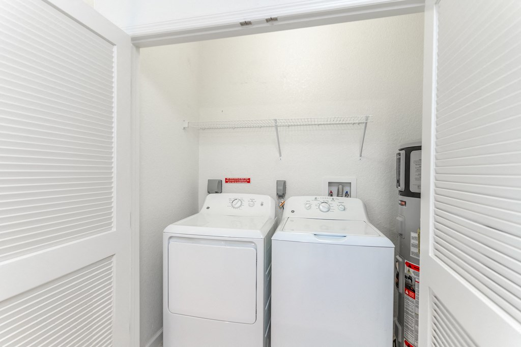 a washer and dryer in the laundry room