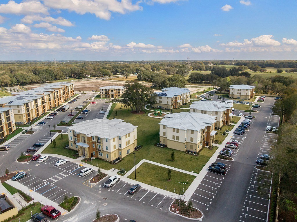 an aerial view of apartment buildings on a city street