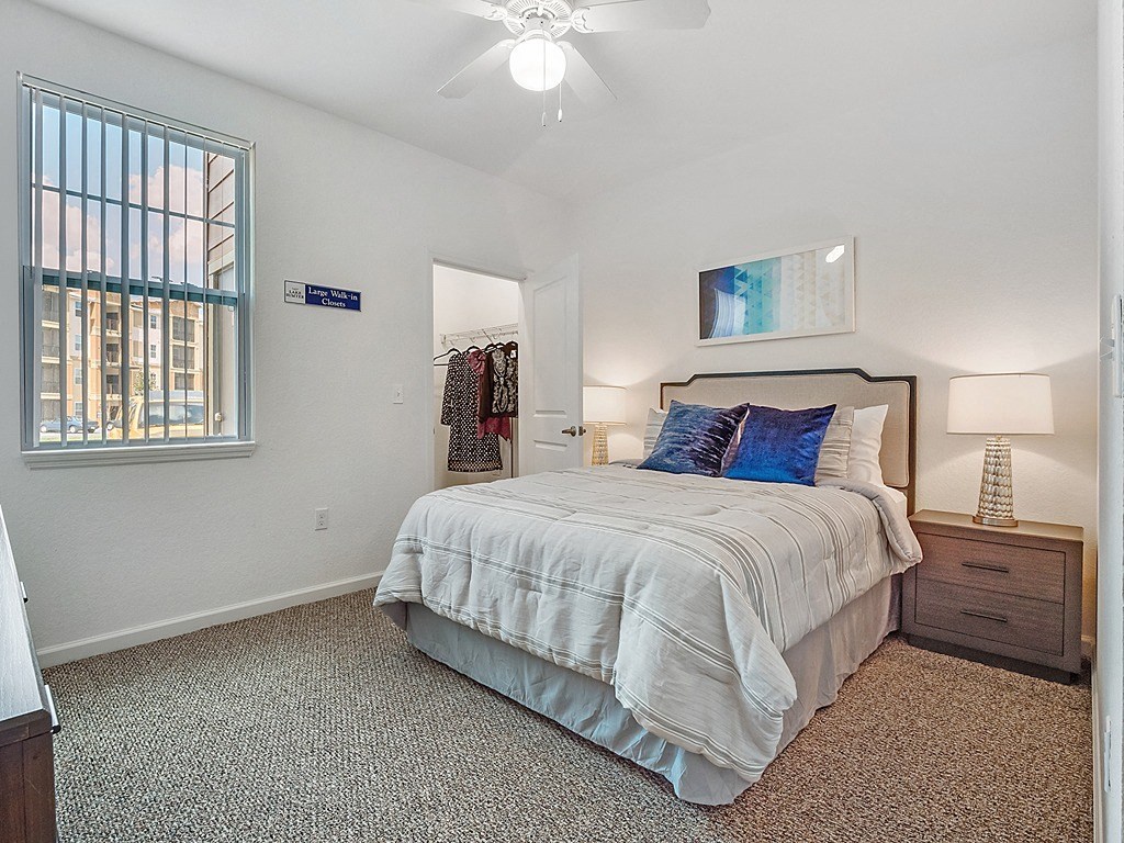 a bedroom with a bed and a closet