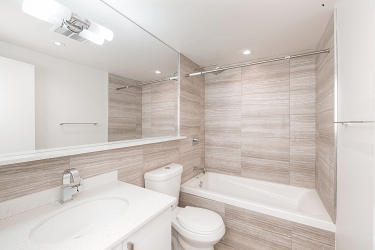 a bathroom with a sink toilet and a bath tub