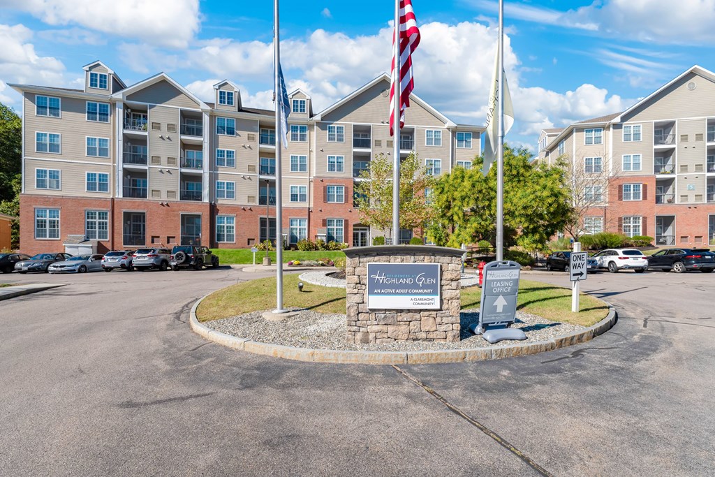 A large building with a sign that says "Hill and Quay" in front of it.