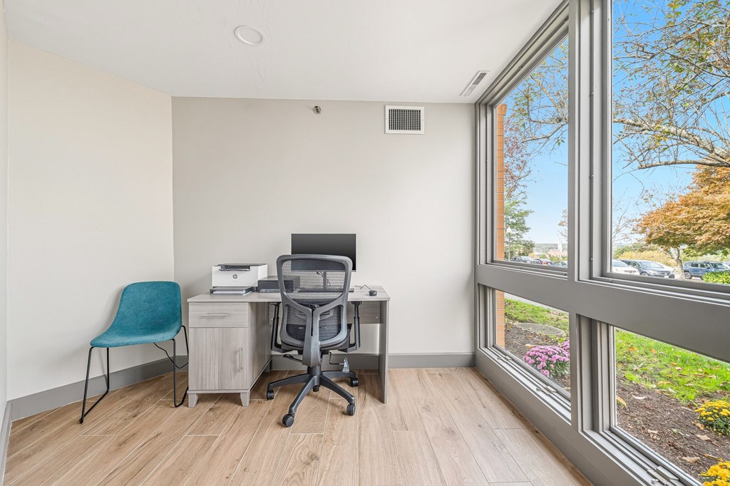 A room with a desk and a chair.