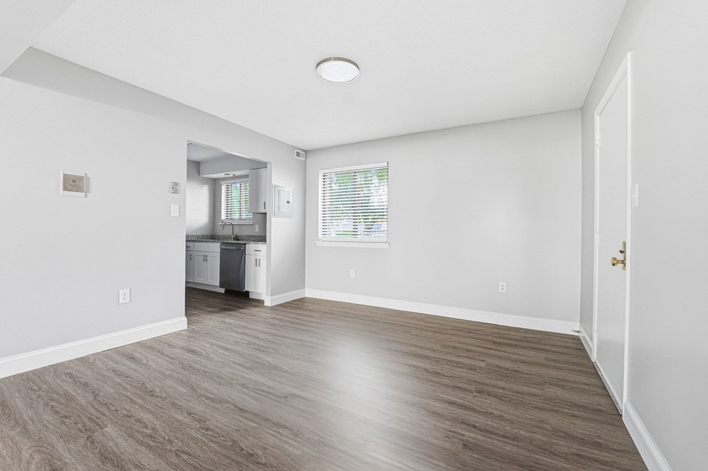 A room with a wooden floor and white walls. at Hidden Brook Apartment Homes, Massachusetts, 02740
