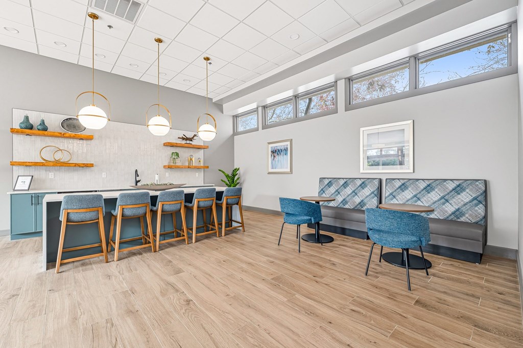 A room with a long table and chairs.