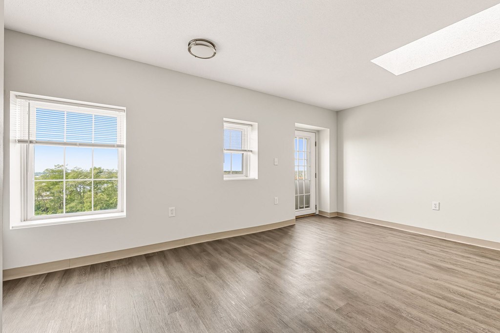 A room with a window and a door.