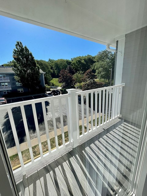 a view from the balcony of a home with a white railing