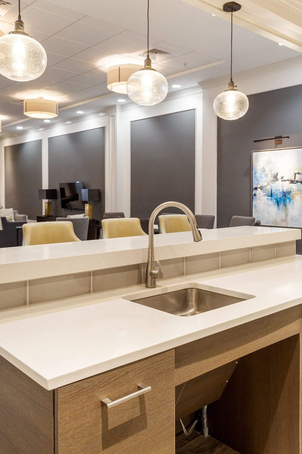 a kitchen counter with a sink and a faucet