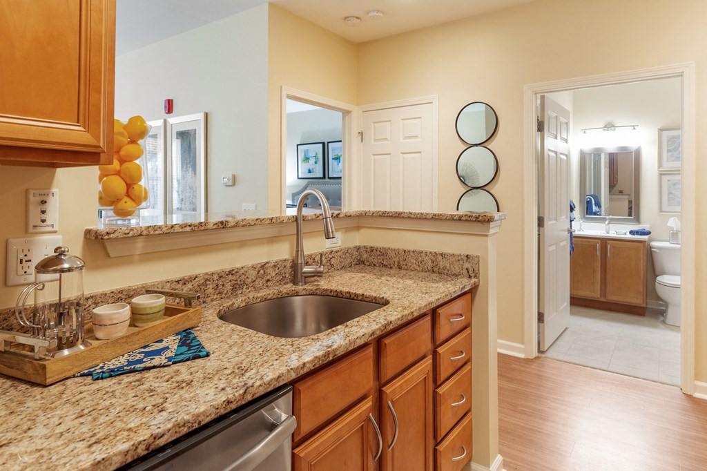 a kitchen with granite counter tops and a sink
