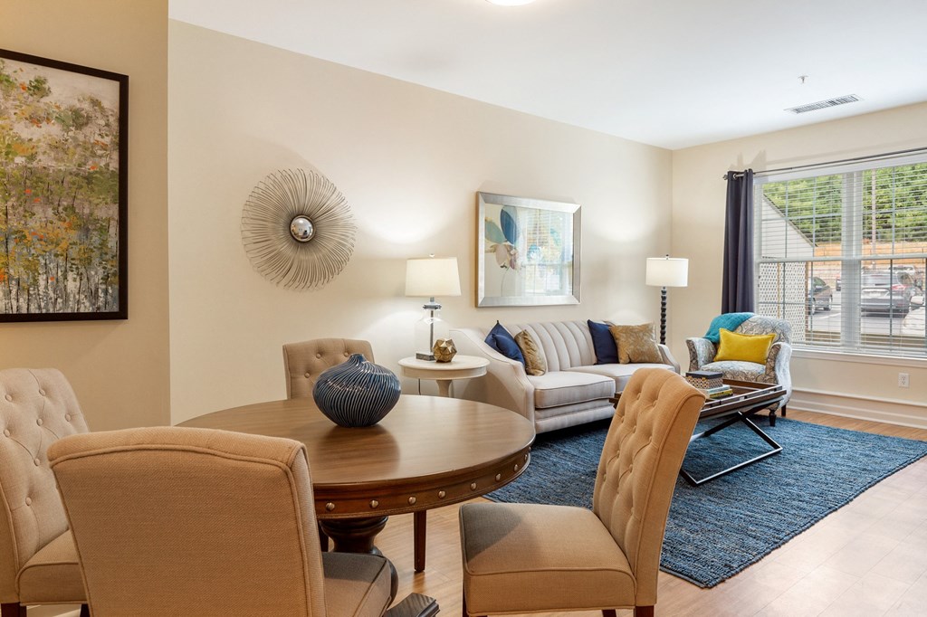 a living room with a dining table and a couch