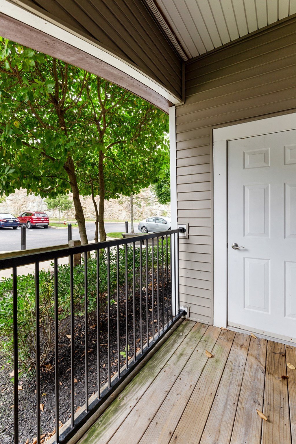 the deck of a house with a white door