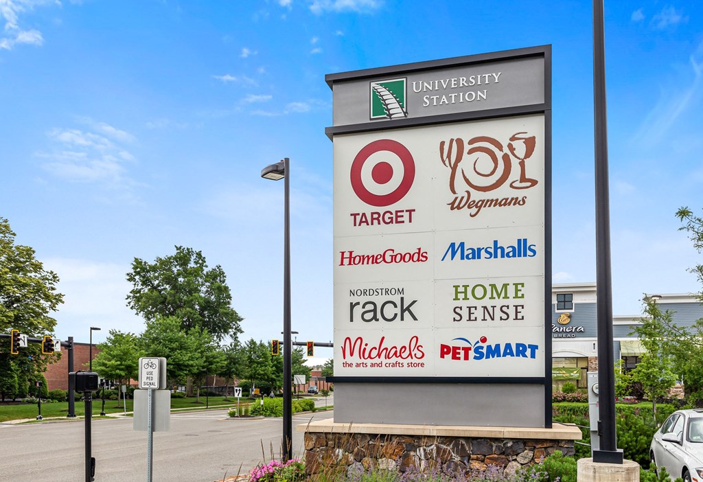 a sign for a target store with a street in the background