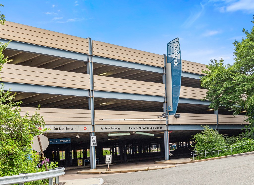 a large parking garage with a street in front of it
