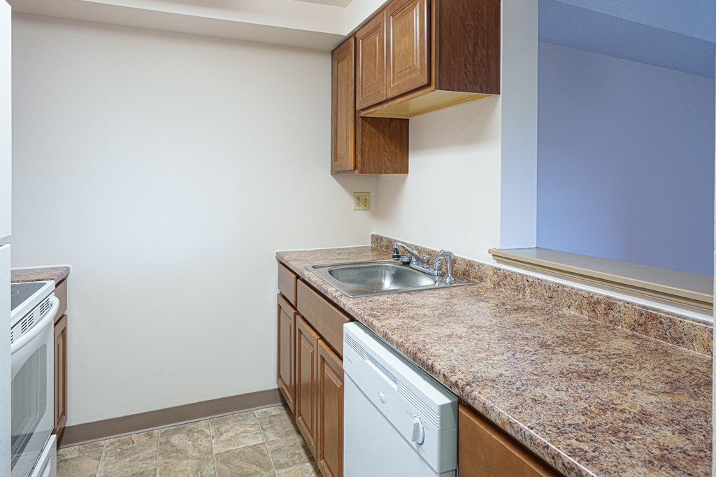 a kitchen with a granite counter top and a sink