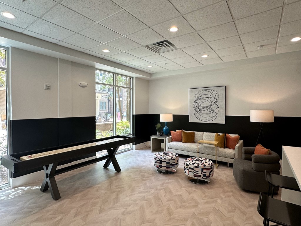 a living room with a piano and a couch