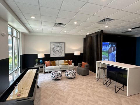 a living room with a couch and a table and a television