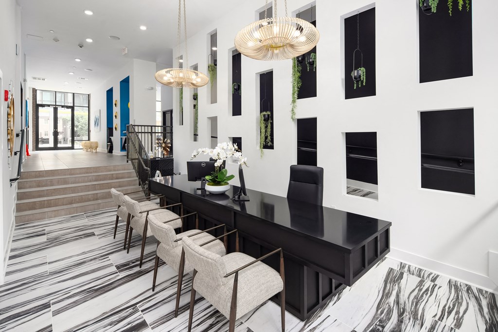 Bright and Bold Reception Space with Monochrome Flooring and Custom Wall Niches Bright and Bold Reception Space with Monochrome Flooring and Custom Wall Niches