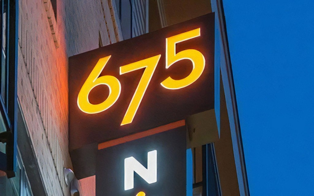Building Sign Lit at Night