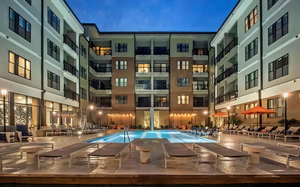 Resort Style Pool with Loungers in Evening