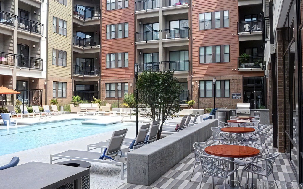 Resort Style Pool with Table Seating and Grills