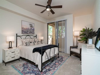 1, 2, & 3 Bedroom Apartments in Scottsdale AZ - Desert Park Vista Apartments - Bedroom with Carpet Flooring and Sliding Door Access to Private Balcony/Patio - Photo Gallery 4