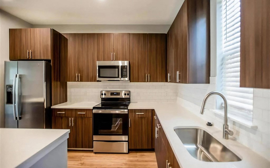 Sleek Kitchen Finishes with Subway Tile Backsplash