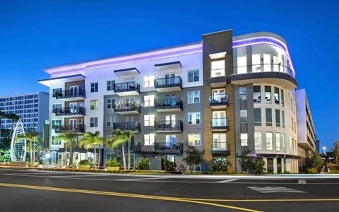 Anchor Riverwalk Apartment Exterior with Balconies and Modern Lighting with Sign