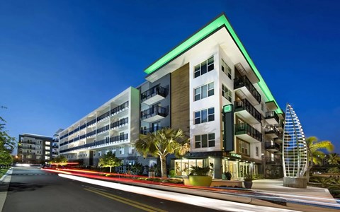 Anchor Riverwalk Entrance Featuring Illuminated Sculpture and Modern Leasing Center