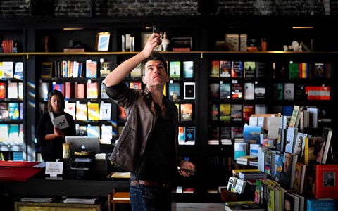 Bookstore Scene Featuring Tall Shelves and Dark Wood Shelving
