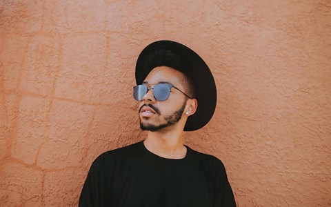 Modern Street Style Portrait with Bold Wall Backdrop