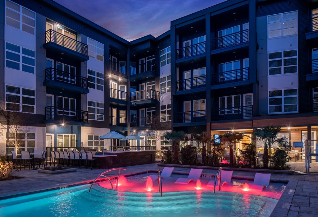 Poolside Scene with Built-In Loungers and Illuminated Water Features