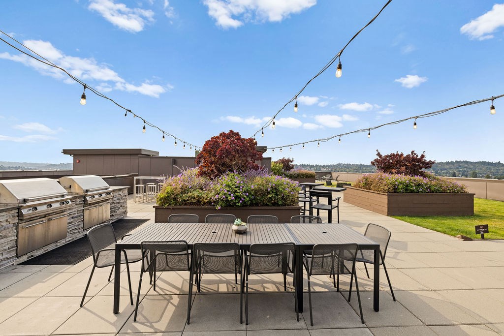A patio with a table and chairs is set up for an outdoor gathering.