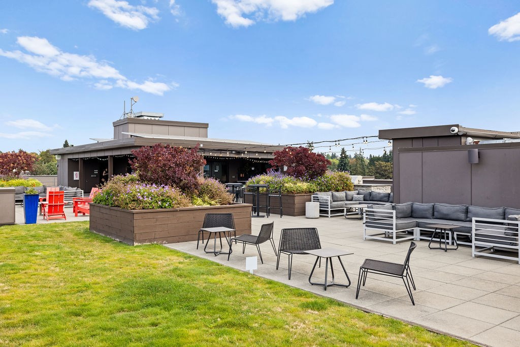 A patio area with a table and chairs.