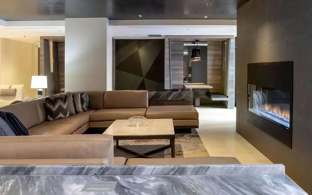 Clubhouse With Built-In Fireplace and Sectional Couch Seating