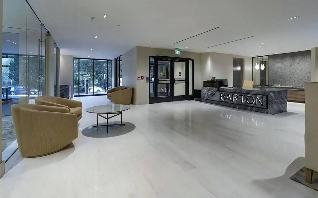 Lobby Entry With Armchairs, Coffee Table, and Reception Desk